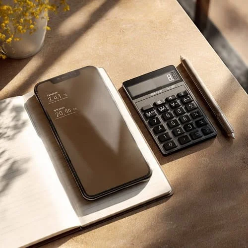 Phone with calculator and notes calculating deal savings